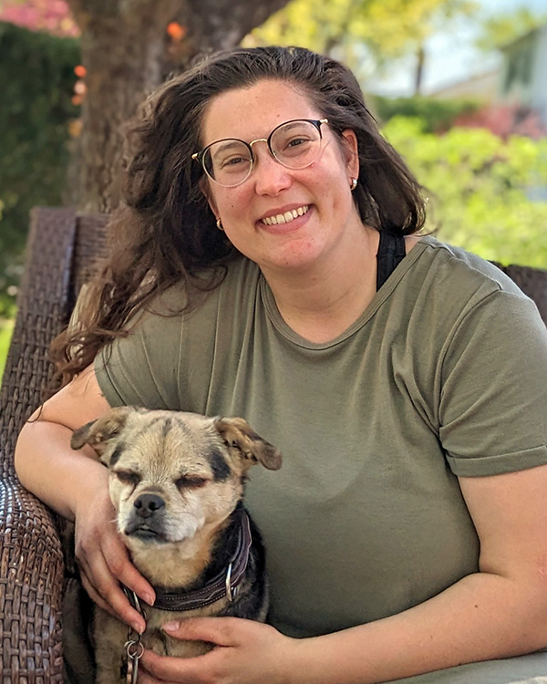 Kristina holding a dog 